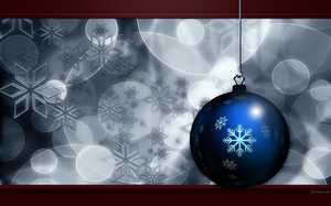 Une boule de Noël bleue sur fond de flocons de neige design.